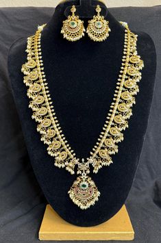 A gold plated peacock design Long Necklace Set with pearl droppings are a popular choice for women who want to wear a beautiful and meaningful piece of jewelry without spending a lot of money. Features: Peacock design long & short necklace Matching earrings Dangles Lightweight and elegant Can be paired with any dress, kurti, or saree Dimensions: Necklace length : 13 in & 8 inch Earring length : 2.2 in Material: Matte Gold Plated Brass CZ Stones Pink,Green, White Faux rice Pearls Closure: Hook Cl Dress Kurti, Long Necklace Set, Rice Pearls, Necklace With Pearl, Necklace Matching, Peacock Design, A Lot Of Money, Hook Clasp, Short Necklace