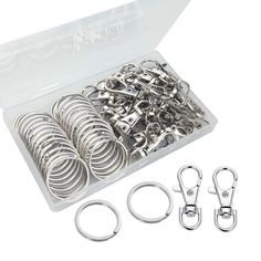 an assortment of metal rings and eyelets in a box