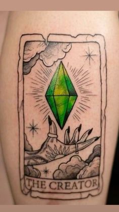 a green diamond tattoo on the back of a woman's leg