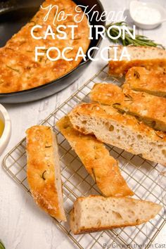 homemade cast iron focaccia bread on a cooling rack