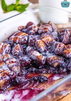 a casserole dish with blueberry sauce in it