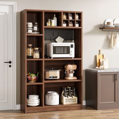 a microwave is on top of a wooden shelf