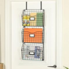 the door is decorated with wire baskets and magnets