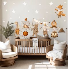 a baby's room decorated in white and brown with stars on the wall, teddy bears hanging from crib