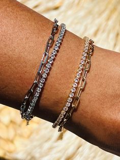 "2mm Dainty Diamond CZ Tennis Double Wrap Bracelet Bracelet:6.5\" with 2\" extensions Available in Sterling Silver and Gold Filled Matching necklace also available -15.5\" with 2\" extension Material: 18 Karat Gold Filled, Hypoallergenic. Tarnish Resistant. Gold-filled does not de-laminate or peel like Gold plated Jewelry nor does it tarnish as readily as silver. Generally speaking, gold filled is better quality and will have a much longer lasting color than plated jewelry. We recommend keeping Dainty Stackable Cubic Zirconia Bracelets, Paperclip Bracelet, Bracelet Layering, Silver Tennis Bracelet, Bracelet Tennis, Double Wrap Bracelet, Bracelet Dainty, Stylish Bracelet, Stackable Bracelets