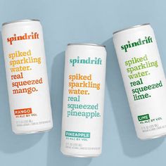 three cans of spindrif sparkling water on a blue background with the words sprinkled