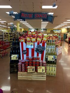 the movie snacks are on display in the grocery store's aisles, along with other items for sale