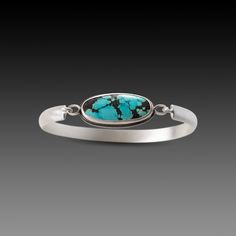 A simple, elegant, sterling silver setting allows this stunning piece of turquoise to sing. Sterling silver bezel and cuff. Cuff measures approximately 2 inches across oval band; half-round band is 1/4 inch wide. Stone measures approximately 1/2 inch x 1 inch. This piece is in stock and ready to ship. Sterling Cuff Bracelet, Jewelry Turquoise, Silver Design, Order Form, Simple Elegant, Silver Cuff Bracelet, Silver Cuff, Turquoise Sterling Silver, Turquoise Jewelry