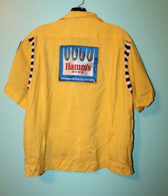 Vintage Deadstock Hamm's Beer Bowling shirt. Rockabilly bowling fun. Rare beer novelty shirt. Features: rayon cotton blend, embroidered "Bob" and "Northwest Beer Dist." on front, large Hamm's patch on back, smaller Hamm's patch on sleeve, one front pocket, shirt jac style.  Tag: The Stretch - Jac Service Bowling Shirt Washable Use No Bleach 15-15 1/2 Sleeves 9" Chest 46" Shoulders: 17.5" Length: 25.5" Excellent unused condition. 1950s Shirts, Hamms Beer, Inktober 2024, Bowling Shirt, Novelty Shirts, Bowling Shirts, Pocket Shirt, Mens Oxfords, Bowling