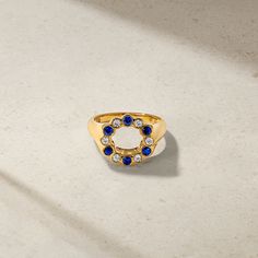 Sapphires and diamonds of alternating sizes are all set within bezels and arranged in a complete circle along the topside of the ring. Considered a symbol of perfection and unity, this is an ideal gift for any loved one. Its chunkier construct makes it stand out on your finger especially when stacked with low profile bands. We love how it looks styled on your pinky finger. Metal: 18kt Gold Sapphire Weight: 0.50 ct. Diamond Weight: 0.23 ct. Measurements: 15.5 mm length *Please note that the liste Pinky Finger, Diamond Signet Ring, Sapphire Jewelry, Ring Size Guide, Signet Ring, Low Profile, Blue Sapphire, Women Rings, Ideal Gift