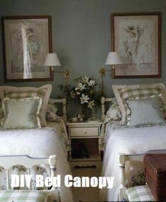 two twin beds in a bedroom with green and white bedding, one has flowers on the nightstand