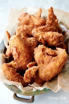 fried chicken wings in a basket ready to be eaten