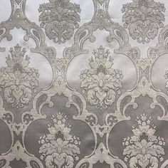 silver and white wallpaper with an ornate design