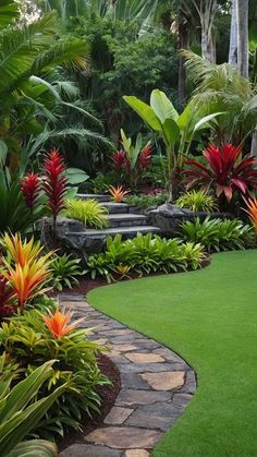 a lush green garden with red and yellow flowers in the foreground, surrounded by palm trees