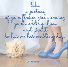 two brides standing next to each other with blue shoes and flowers on the floor