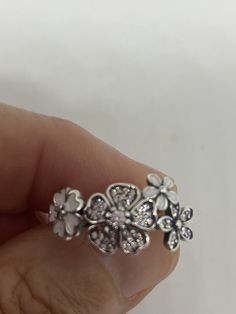 Brooklyn Line Micro Cubic Zirconia Crystal white enamel flower Sterling Silver Band ring Hand made in Brooklyn NY Micro band ring All pave set Cubic Zirconia in Rhodium Sterling Silver to prevent tarnish We have sizes 5, 6, 7 or 9 Can be re sized for a $10 fee PLEASE add ring size to notes in your order!! Thanks. All rings are shipped in a nice gift box. Check out our over a THOUSAND great reviews Engraving is $4 per letter and is not always perfect depending on the piece. It can take a few days Enamel Flower Ring For Anniversary, Anniversary Flower Enamel Ring, White Flower Shaped Anniversary Ring, White Sterling Silver Flower Ring, White Flower Shape Promise Ring, White Flower Shaped Promise Ring, Silver Flower Enamel Ring As A Gift, White Flower-shaped Promise Ring, Jewelry Accessories Ideas