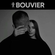 a man kissing a woman's forehead with the words bouvier on it