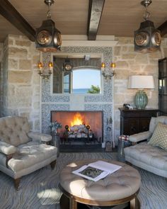 a living room filled with furniture and a fire place