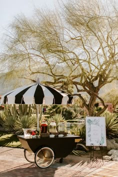 a table with an umbrella and some drinks on it