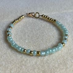 - One Of A Kind Beaded Charm Bracelet - Featuring Turquoise And Gold Seed Beads - Gold Colored Hardware - Clasps Closed. No Stretch. - Size/ Circumference Is 7” - Handmade (By Myself). Perfect To Treat Yourself Or To Give As A Unique Gift! **Add 2 Jewelry Items Marked “2 For $20” To Your Bundle And I Will Send You An Offer For $20** Check Out The “Boutique” Tab In My Closet For Handmade Earrings, Bracelets, And Necklaces! Gold Bead Bracelet, Beaded Charm Bracelet, Gold Beaded Bracelet, Pearl Bracelets, Turquoise And Gold, Beads Bracelet Design, Jewelry Accessories Ideas, Silver Bead Bracelet, Bracelets And Necklaces