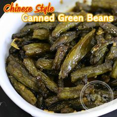 chinese style canned green beans in a white bowl on a black table with text overlay