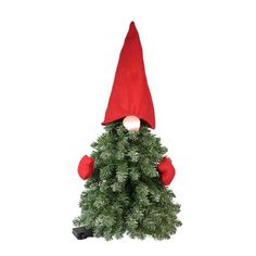 a small christmas tree with a red hat on top