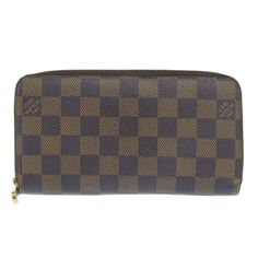 Introducing the Louis Vuitton Zippy Wallet in Brown Damier Canvas, a versatile and timeless accessory suitable for both men and women. Crafted with meticulous attention to detail, this wallet showcases the iconic Damier pattern, synonymous with the Louis Vuitton brand.Designed to meet the demands of modern life, the Zippy Wallet features a spacious interior with multiple compartments for organizing cards, bills, and coins. The durable canvas material ensures longevity, while the brown color adds Louis Vuitton Wallet Zippy, France Colors, Canvas Wallet, Timeless Accessories, Brown Canvas, Modern Life, Long Wallet, Authentic Louis Vuitton, Canvas Material