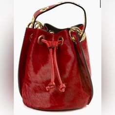 * Crimson Red * Measurements: 10" X 8" 1/2 X 6" 1/2 * Material: Genuine Leather * Crossbody Strap Elegant Red Bucket Bag For Formal Occasions, Elegant Red Bag With Brass Hardware, Elegant Red Shoulder Bag With Brass Hardware, Red Rectangular Formal Bucket Bag, Elegant Red Bucket Bag, Elegant Red Bucket Bag For Shopping, Formal Red Rectangular Bucket Bag, Red Crossbody Bucket Bag With Gold-tone Hardware, Formal Red Bucket Bag With Gold-tone Hardware