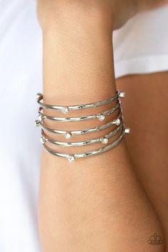 Sporadically dotted in glassy white rhinestones, thick silver bars stack across the wrist, coalescing into a statement-making cuff. Sold as one individual bracelet. Paparazzi Jewelry Images, Pink Jewels, White Bracelet, White Bracelets, Stacked Bangles, Paparazzi Accessories, White Rhinestone, Silver Bars, Affordable Jewelry