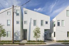 two large white buildings sitting next to each other