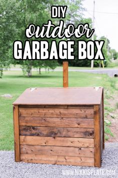 the diy outdoor garbage box is made out of wood