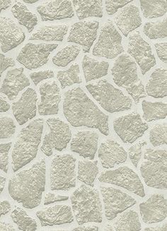 a stone wall that has been painted white