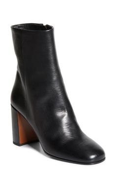 This Italian-made calfskin-leather bootie is perched on a logo-gilded demi-block heel that brings a modern feel to the classic style. 3 1/4" (85mm) heel Side zip closure Leather upper and lining/rubber and leather sole Made in Italy Designer Shoes Leather Mid-calf Boots With Sculpted Heel, Elegant Leather Mid-calf Boots With Sculpted Heel, Luxury Leather Booties With Sculpted Heel, Luxury Leather Mid-calf Boots With Sculpted Heel, Platform Slippers, Kids Sandals, Designer Clothes For Men, Leather Booties, Modern Outfits