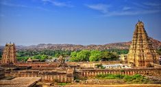 an aerial view of the ancient city of hampiya, with mountains in the background