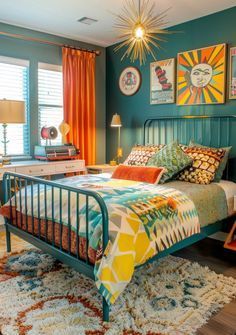 a bedroom with blue walls, orange curtains and a bed in the middle is surrounded by colorful rugs