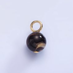 Description: - Material: Brass, 14K Gold Filled, Freshwater Pearl - Size: 16.5mm x 10.2mm x 10.2mm  - Bail Size: 4.2mm / 3.3 MM - Quantity: 1 piece - Color: Gold - Lead Free, Nickel Free Please avoid chemical solutions, perfumes, excessive sweat, ocean water and swimming water. Salt water and chlorine can damage your jewelry. Chlorine can damage and discolor metals that are alloyed with the gold and can slowly erode the finish and polish of gemstones. Also, lotions and sprays create a film on th Elegant 8mm Round Beads For Gems And Cabochons, Elegant 8mm Round Beads For Jewelry Making, Marble Color Jewelry With Round Natural Stone Beads, Marble Jewelry With Natural Stones In Round Beads, Gold Gemstone Beads And Cabochons, Gold Gemstone Round Beads, Gems And Cabochons, Gold Agate Beads For Jewelry Making, Elegant Amber Beads, Gems, And Cabochons, Gold Cabochon Round Beads Jewelry