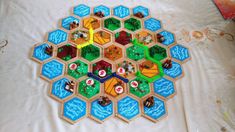 a board game is shown on a bed with the pieces laid out and ready to be played