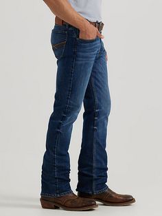 A MODERN TAKE ON A CLASSIC FIT Wrangler® 20X® vintage bootcut jeans combine the comfort you want with the durability you need to take on each day with confidence. No. 42 jeans from the Wrangler® 20X® collection are finished with distressed detailing for an instant broken-in appeal. They sit just below the waist for a casual look you can wear on any occasion. They also feature a slim seat and thigh as well as a full opening from the knee down to leave room for your boots. The Wrangler® 20X® vinta Men’s Bootcut Jeans, Rugged Dark Wash Bottoms For Ranch, Rugged Straight Leg Bottoms For Ranch, Country Boy Outfits, Vintage Bootcut Jeans, Bootcut Jeans Outfit, Bootsy Collins, Jeans Outfit Men, Mens Outdoor Clothing