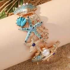 Ocean Beach Shell Wrist Or Ankle Bracelet. New Adjustable. Made With: Alloy, Rhinestones, Pearls. Toggle Clasp. Size: 8.25 Inches In Length. Bohemian Starfish Jewelry For Vacation, Starfish Jewelry For Vacation, Bohemian Summer Jewelry In Ocean Color, Summer Bohemian Blue Jewelry, Summer Bohemian Style Blue Jewelry, Summer Bohemian Ocean Color Jewelry, Summer Beach Bracelets Made Of Shell, Starfish Shaped Shell Jewelry For Beach, Starfish Shell Jewelry For Beach