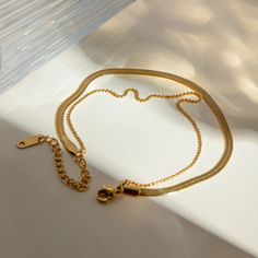 Discover Effortless Elegance with Our Exquisite Double Layer Snake Chain Anklet Welcome to a world of timeless beauty and impeccable style! Our Exquisite 18k Gold Plated Double Layer Snake Chain Anklet is the epitome of elegance and sophistication, designed to elevate your summer look to new heights. Crafted with precision and attention to detail, this anklet is a must-have accessory for the modern woman who appreciates luxury and quality. Product Features: Technology: 18 K Gold Plated Material: Stainless Steel (Rust Proof) Weight: 3.63 g Features: Waterproof, Classic, Vintage Scene: Perfect for Parties, Anniversaries, and Weddings Allergen-Free: Nickel, Lead, and Cadmium-Free Our anklet is meticulously crafted with a durable stainless steel base, ensuring long-lasting wear without comprom Elegant Metal Anklet With Adjustable Chain, Elegant Gold Metal Anklet, Elegant Gold Chain Anklet, Elegant Yellow Gold Chain Anklets, Elegant Adjustable Tarnish Resistant Anklets, Minimalist Gold Chain Anklets, Vintage Scene, Small Animal Supplies, Waist Bags