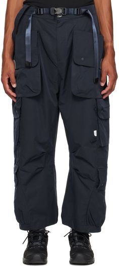 Polyester taffeta cargo pants. Cargo pockets and loops throughout. · Detachable hook-eye strap at partially elasticized waistband · Integrated magnetic belt · Four-pocket styling · Zip-fly · Logo flag at front · Detachable patch pocket at outseams · Pleats at inseams Supplier color: Navy