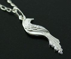 This unique pendant is made with sterling silver and represents a unique and beautiful motif of  bird inspired by the phoenix. It is a very original design drawn and made by the artist.  It is a one-of-a-kind jewel which will pass the test of time. A perfect present  for birthday(anniversary), Mother's Days, wedding, Christmas or to offer itself to oneself! dimensions : 2.7 cm x 0.7 cm matching earrings : https://www.etsy.com/ca/listing/219672188/silver-bird-earring-phenix-earring?ref=shop_home_active_40 matching bracelet : https://www.etsy.com/ca/listing/263440235/phoenix-bracelet-silver-phoenix-bracelet?ref=shop_home_active_23 Silver Bird Design Pendant Necklace, Silver Bird Pendant Jewelry, Sterling Silver Bird Pendant Jewelry, Unique Bird Design Pendant Jewelry, Silver Bird-shaped Sterling Silver Necklace, Sterling Silver Bird Necklace, Sterling Silver Necklace With Bird Design, Silver Sterling Silver Necklace With Bird Design, Elegant Sterling Silver Necklace With Bird Design