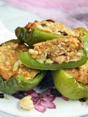 stuffed bell peppers are piled on top of each other with nuts and seeds in them