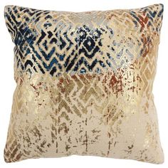 a gold and blue pillow on a white background