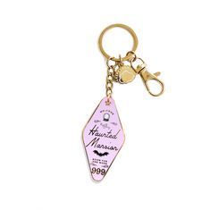 a keychain with a pink and purple design on it