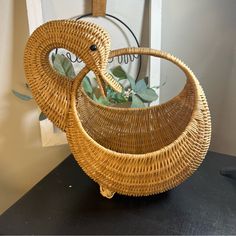 a wicker basket sitting on top of a table