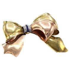 Check out this item from 1stdibs! Cartier Retro Sapphire Diamond Two Color Gold Bow Brooch: https://www.1stdibs.com/id-j_21902142 Bow Brooch, Cartier Jewelry, Step Cut, Timeless Jewelry, The Shape, Sapphire Diamond, Bezel Setting, Cartier, Bright White