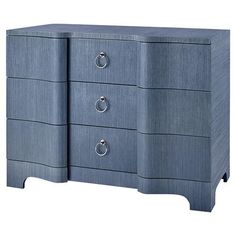 a blue dresser with three drawers and two handles