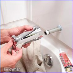 a person is using a hair dryer on the sink