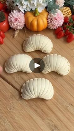 the video is showing how to make bread for thanksgiving dinner with pumpkins and gourds in the background